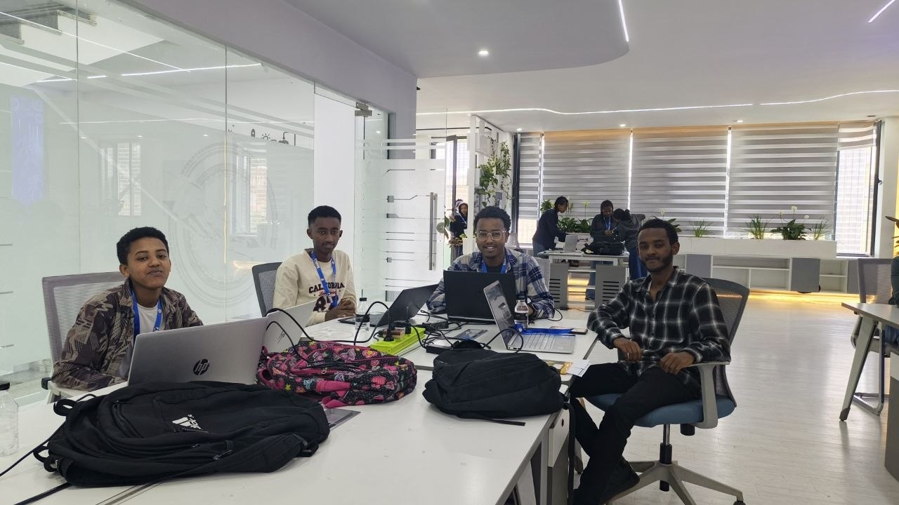 EthioCoding Academy learners collaborating with laptops